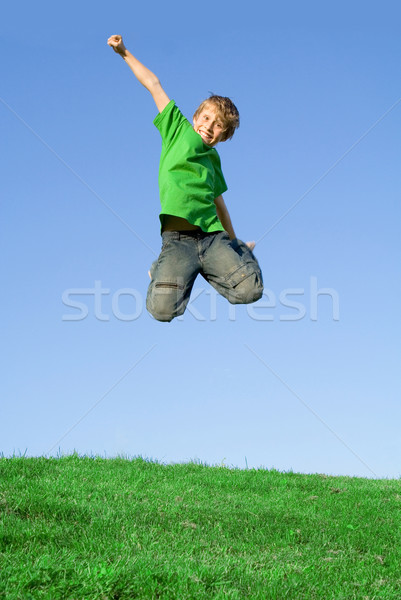 happy kid jumping outside in summer Stock photo © godfer