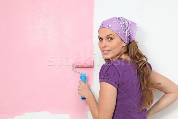 Mujer pintura vivero pared Foto stock © godfer