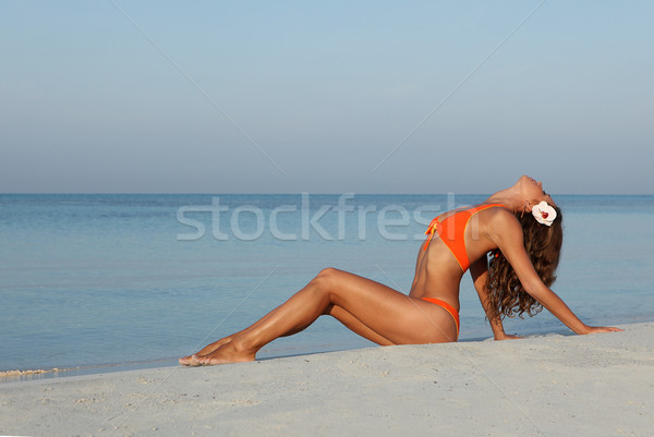 slim woman relaxing on beach holiday vacations Stock photo © godfer