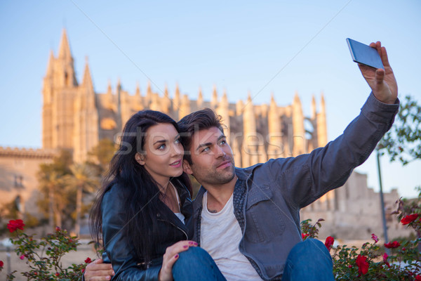 tourists couple at cathedral in Palma de Mallorca Spain Stock photo © godfer