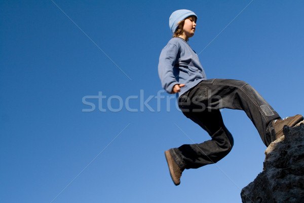 happy healthy kid playing outdoors rock climbing Stock photo © godfer