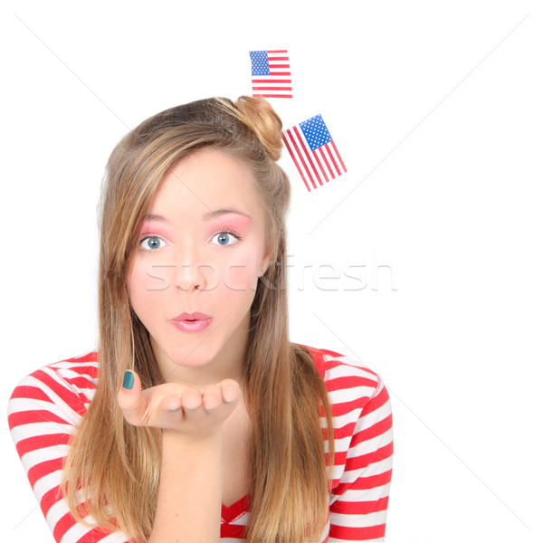AMERICAN  GIRL BLOWING WISHES OR KISSES CELEBRATING 4TH OF JULY  Stock photo © godfer