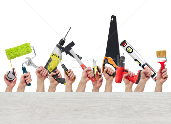 Hands with tools and wood board Stock photo © goir