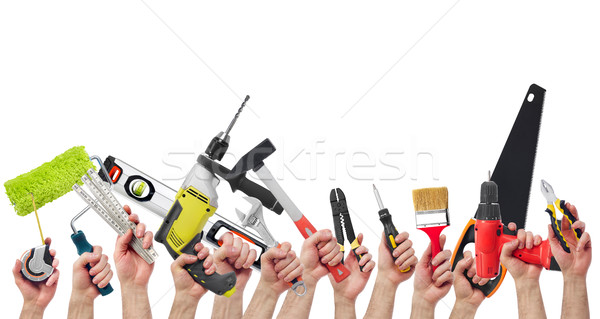 Hands holding tools Stock photo © goir