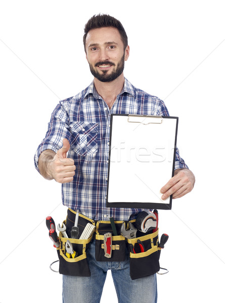 Confident handyman with clipboard Stock photo © goir