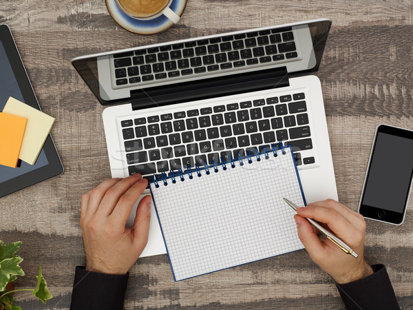 Man at desk with notebook Stock photo © goir