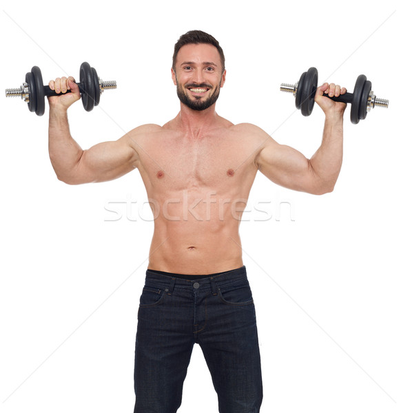 Stock photo: Cheerful weights lifter