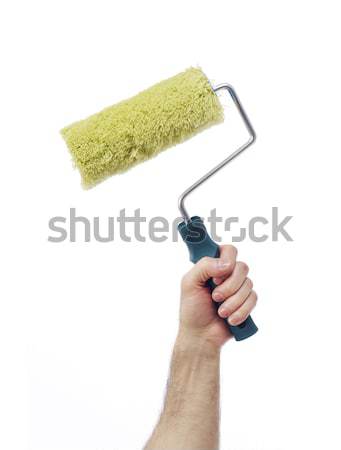 Hand with paint roller Stock photo © goir