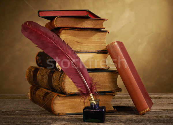 Ink pot, quill and antique books Stock photo © goir