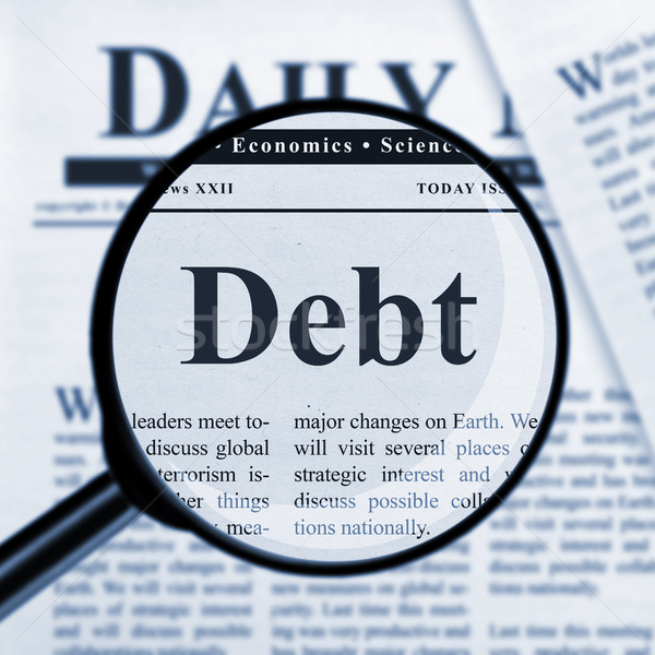 Debt under magnifying glass Stock photo © goir
