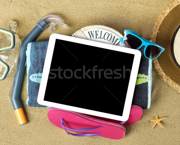 Tablet and beach accesories on sand Stock photo © goir