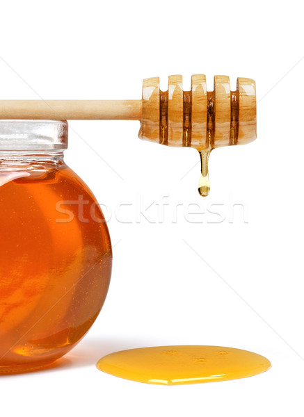 Stock photo: Honey pot and honey dipper close-up