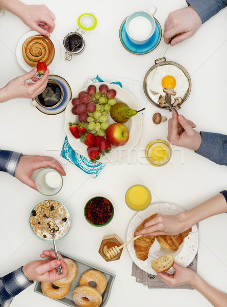Above view of people eating breakfast Stock photo © goir