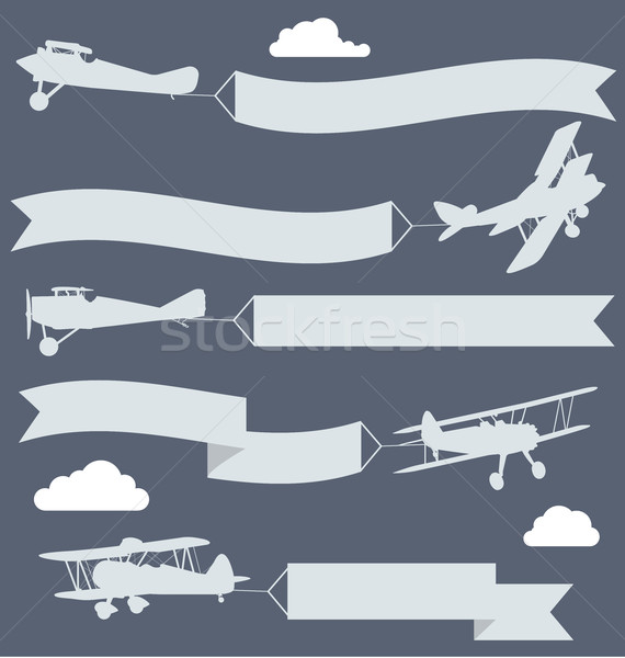 Silhouettes of biplanes with wavy greetings banner Stock photo © gomixer