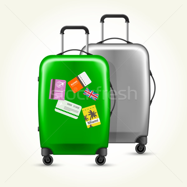 Wheeled suitcases with travel tags - silver and green baggage Stock photo © gomixer