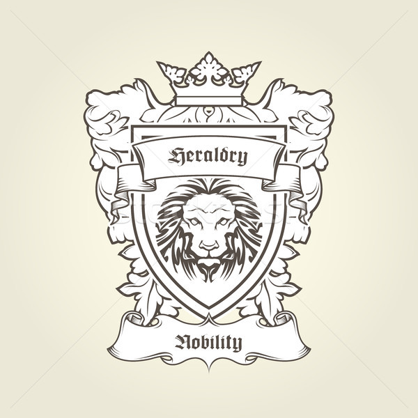 Heraldic emblem - coat of arms with head of lion on shield with  Stock photo © gomixer