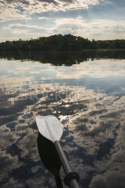 Kayak Paddle Above the Cloud Reflection Stock photo © Gordo25