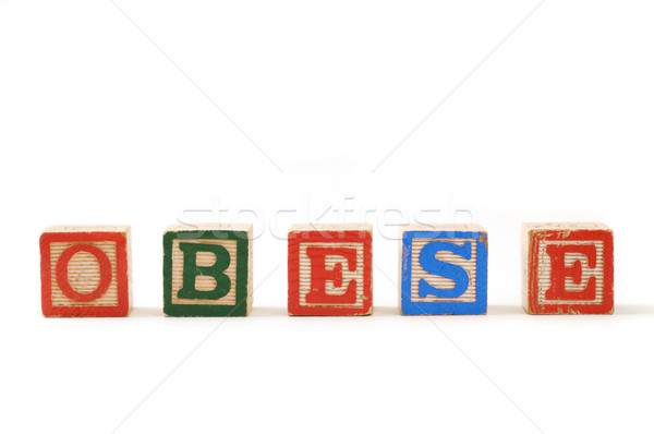 Elhízott fakockák helyesírás szó fehér levél Stock fotó © Gordo25