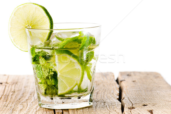 Verre mojito chaux bois table en bois isolé [[stock_photo]] © gorgev