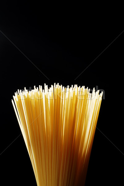 Espaguete backlight amarelo isolado preto Foto stock © gorgev