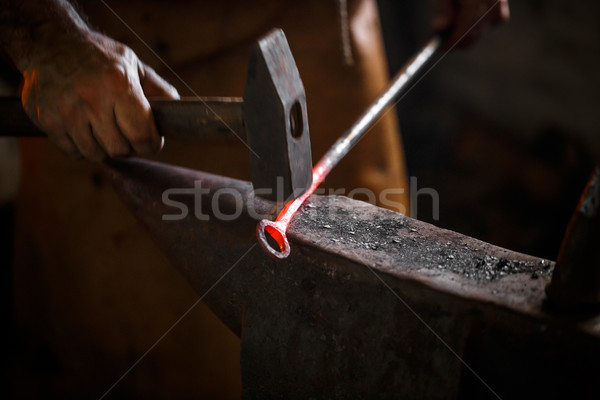 Stock photo: The blacksmith forge the hot metal