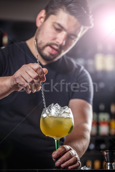 Bartender is stirring cocktail Stock photo © grafvision