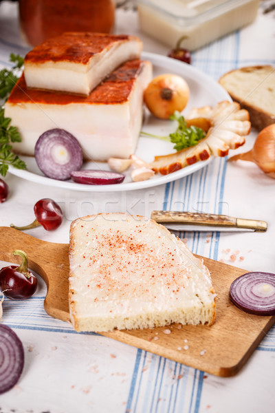Stock photo: A slice of bread spread with lard