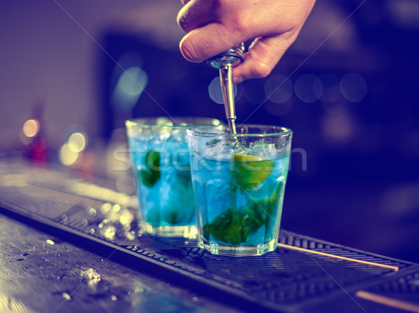 Bartender is pouring blue syrup Stock photo © grafvision
