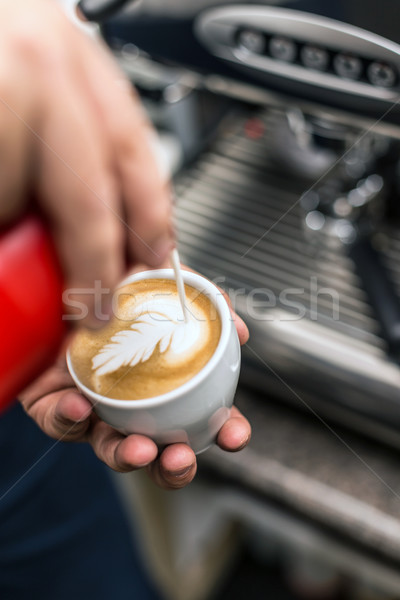 Barista creating latte art Stock photo © grafvision