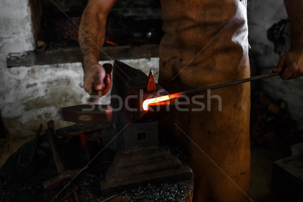 Stock photo: The blacksmith forge the hot metal