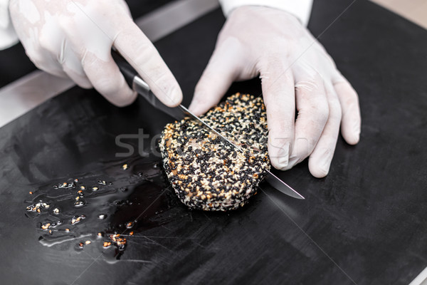 Chef cutting roasted tuna Stock photo © grafvision