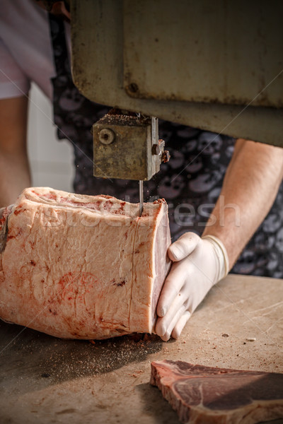 Worker cuts beef meat Stock photo © grafvision