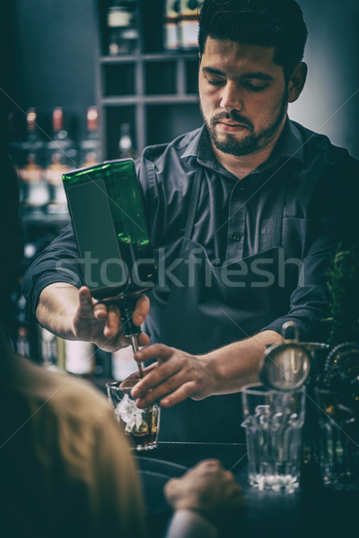 Bartender is serving cocktai Stock photo © grafvision