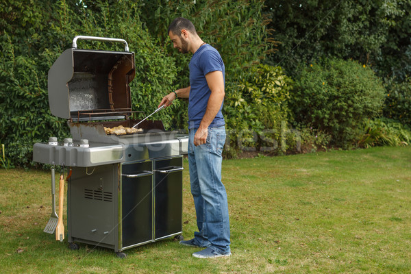 Man at a barbecue grill Stock photo © grafvision