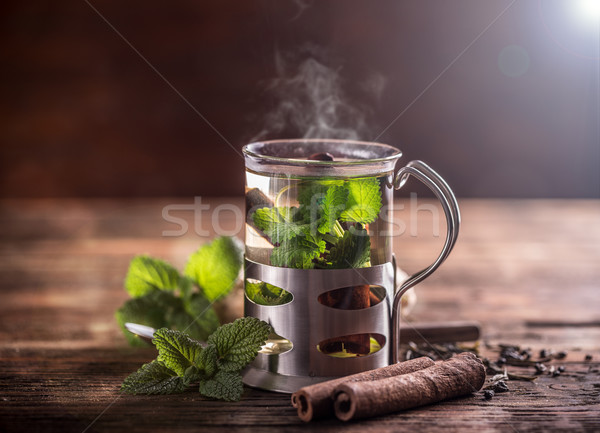 Cup tè vetro tavolo in legno cannella menta Foto d'archivio © grafvision
