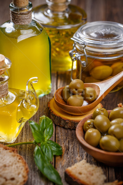 https://img3.stockfresh.com/files/g/grafvision/m/27/9339828_stock-photo-olive-oil-in-glass-bottle-and-olives.jpg