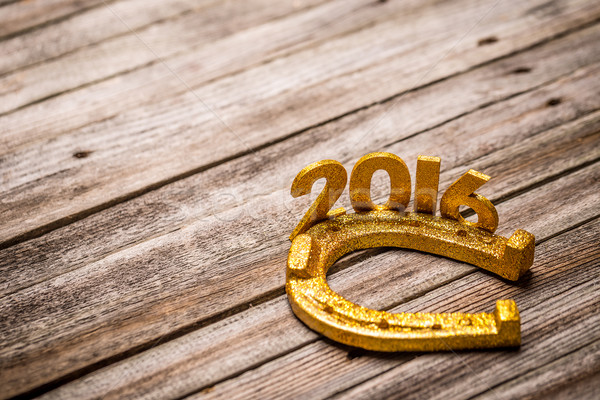 Text 2016 with golden horseshoe Stock photo © grafvision