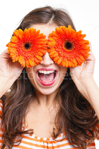 Woman covering her eyes with flowers Stock photo © grafvision