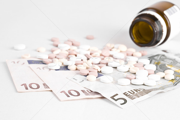 Pillole soldi care medicina bottiglia finanziare Foto d'archivio © grafvision