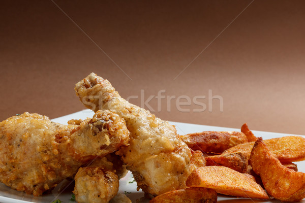 Marinato pollo gambe patate fette Foto d'archivio © grafvision