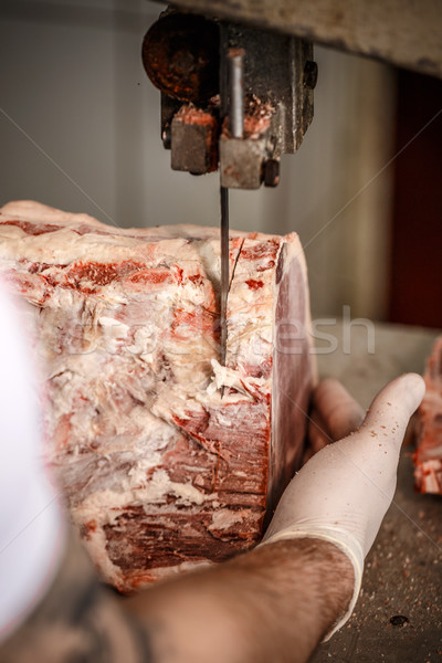 Butcher is cutting meat  Stock photo © grafvision