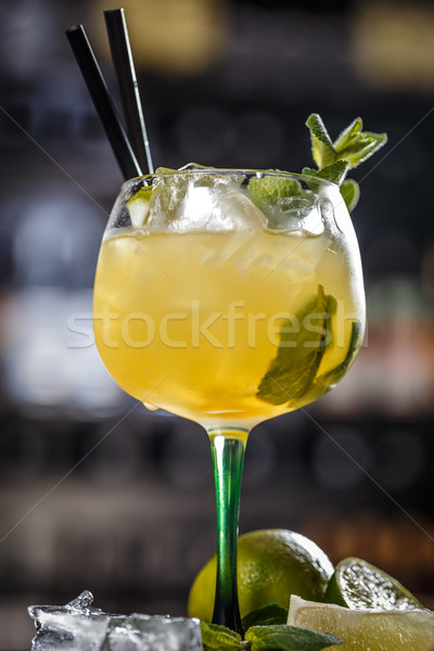 Cocktail garnished with a lime slice and mint leaf Stock photo © grafvision