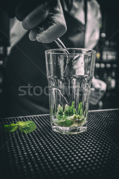 Bartender is pouring lime juice Stock photo © grafvision