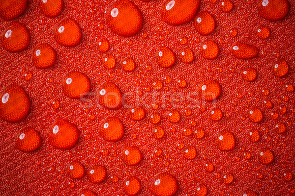 Tropfen Wassertropfen Wasser rot wasserdicht Stoff Stock foto © grafvision
