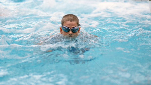 Boy swimming in pool Stock photo © grafvision