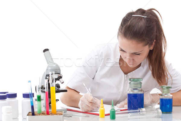 Sério feminino cientista escrita clipboard mulher Foto stock © grafvision