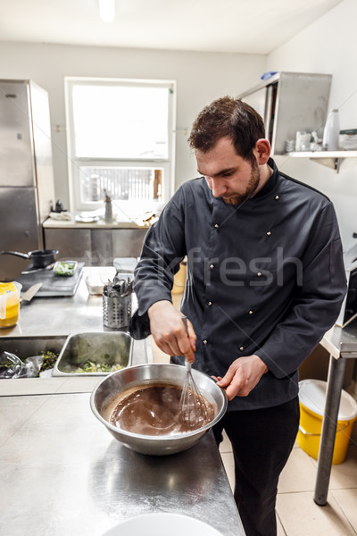 Chef beating chocolate, eggs and butter  Stock photo © grafvision