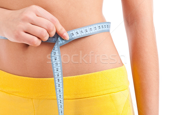 Stock photo: Woman measuring