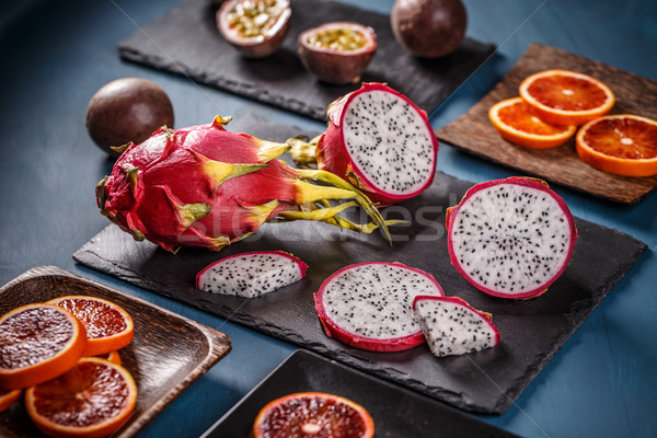 Trópusi gyümölcs sárkány gyümölcs fekete étel narancs Stock fotó © grafvision