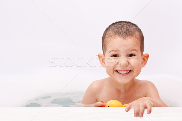 Boy playing in the water Stock photo © grafvision